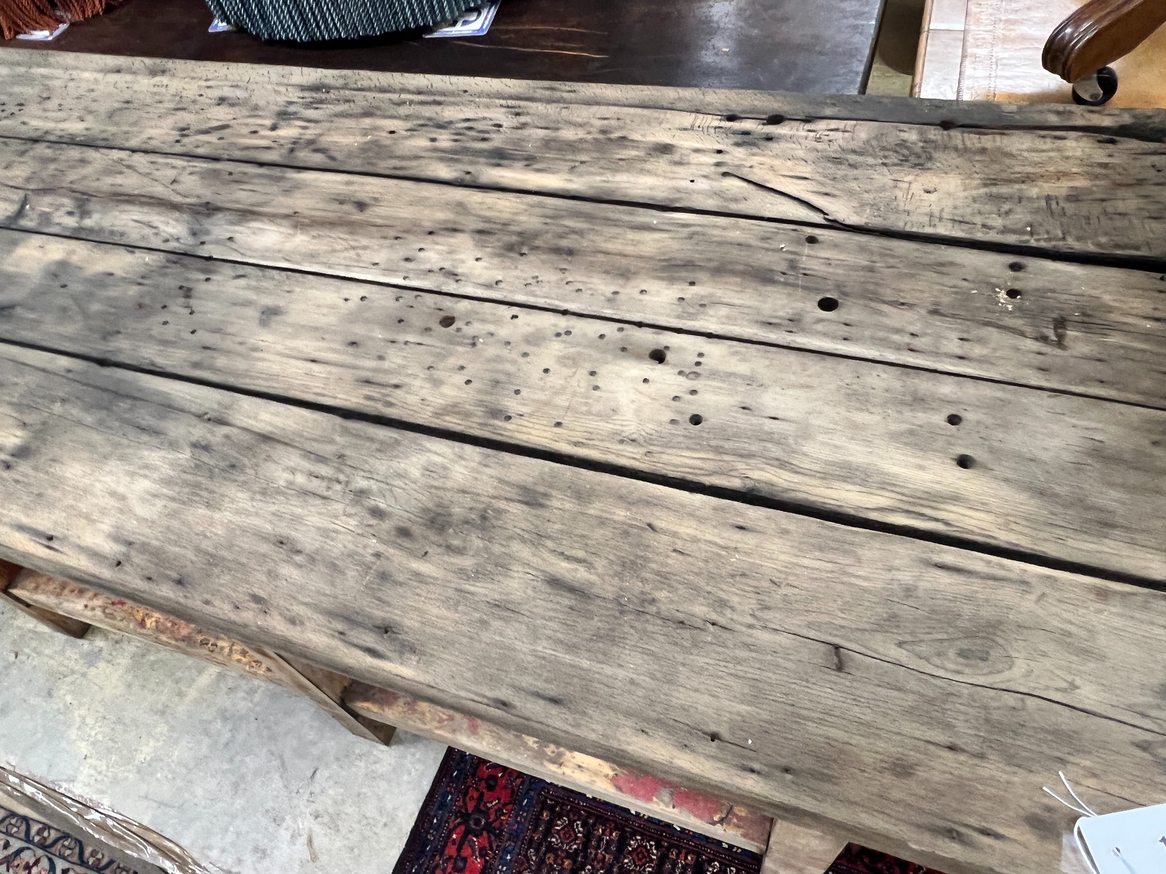 A planked top part painted work bench, width 242cm, depth 68cm, height 84cm